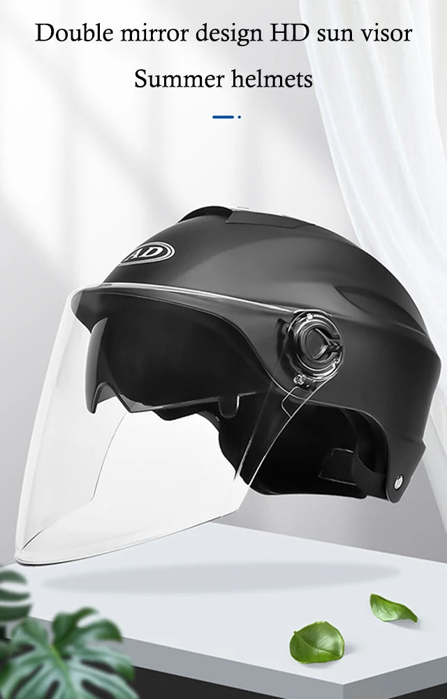 Black summer helmet with clear visor on a white background